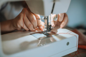 Woman sewing face mask for corona covid pandemic with sewing machine, Woman sewing face mask for corona covid pandemic with sewing machine,